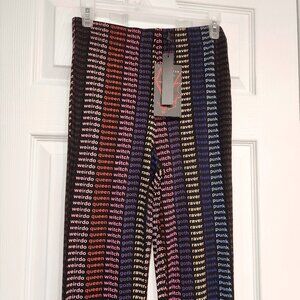 Stretchy colorful flare pants from Killstar size Small with word print